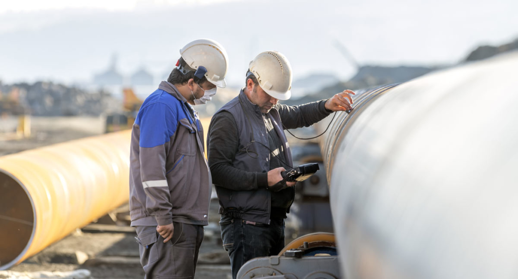 Two men from Buffalo Inspections conducting welding inspections